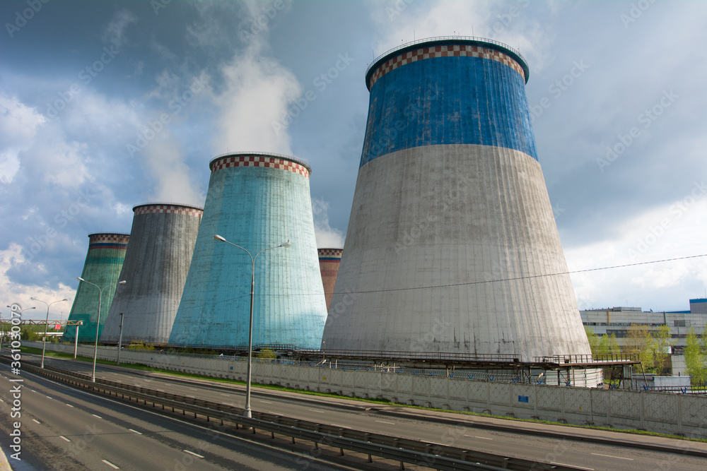 Cooling towers of a thermal power plant on a sunny summer day.