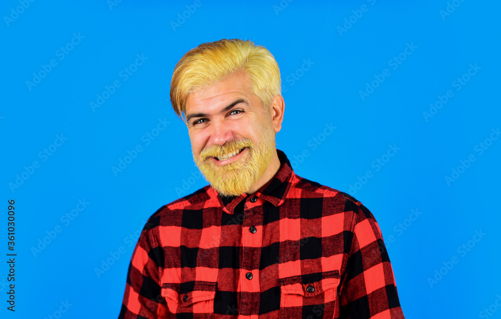 Barber shop concept. brutal male blonde hair portrait. happy man casual fashion. barber master with moustache. bearded man checkered shirt. mature hipster dyed beard. hairdresser and barbershop Barber shop concept. brutal male blonde hair portrait. happy man casual fashion. barber master with moustache. bearded man checkered shirt. mature hipster dyed beard. hairdresser and barbershop