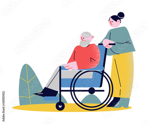 Young woman rolling whellchair helping elderly man to move outdoors