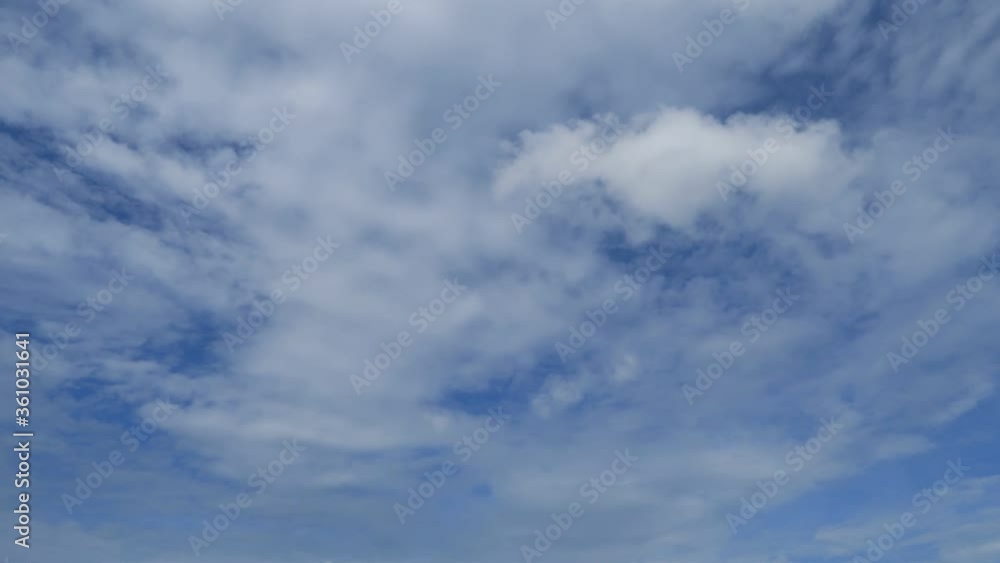 TimeLapse of Dramatic puffy fluffy white & dark gray cloud or cumulus cloudscape before thunderstorm or heavy rain on sunny daylight horizon in tropical summer climate season at daylight sunshine day TimeLapse of Dramatic puffy fluffy white & dark gray cloud or cumulus cloudscape before thunderstorm or heavy rain on sunny daylight horizon in tropical summer climate season at daylight sunshine day