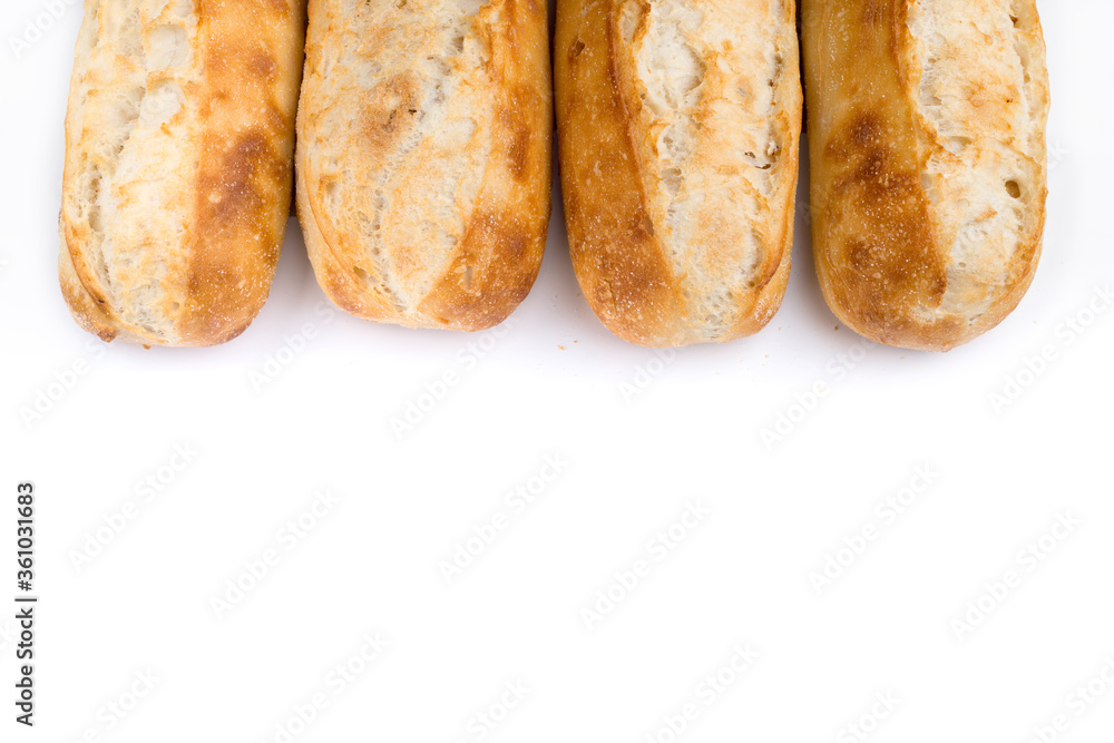French bread rolls in a row with copy space. French bread rolls in a row with copy space.