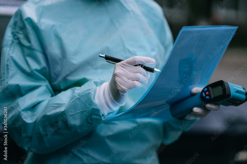 Nurse wears a protective suit and mask during the COVID19 outbreak. Nurse wears a protective suit and mask during the COVID19 outbreak.