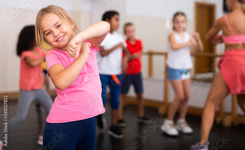 Girl exercising in group during dance class