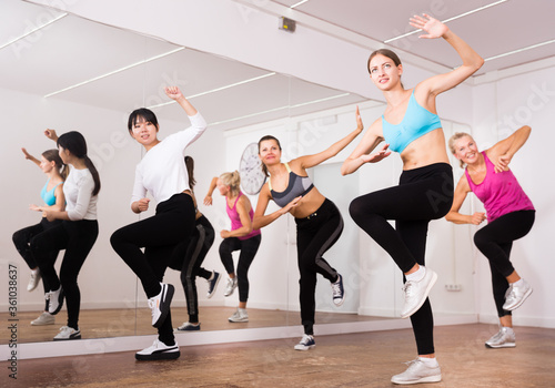 Women dancing aerobics at lesson in the dance class