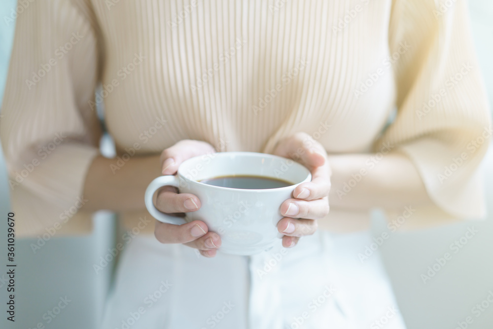 Cup of coffee. Woman drinking tea or coffee. White cup of hot beverage in the morning. Cup of coffee. Woman drinking tea or coffee. White cup of hot beverage in the morning.