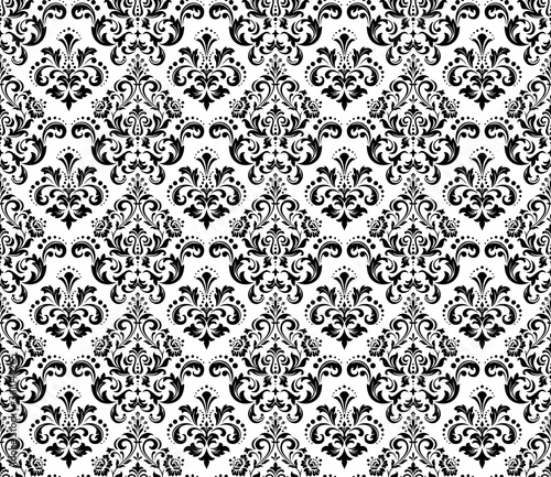Wallpaper in the style of Baroque. Seamless vector background. White and black floral ornament. Graphic pattern for fabric, wallpaper, packaging. Ornate Damask flower ornament