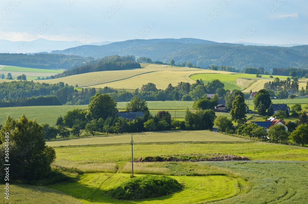 Beautiful Czech republic countryside with fields and mountains in the background