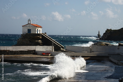 Waves at the small harbour in front of the Chapel of Panagia Thalassini at Andros, Greece  photo