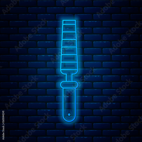 Glowing neon line Chisel tool for wood icon isolated on brick wall background. Vector Illustration.