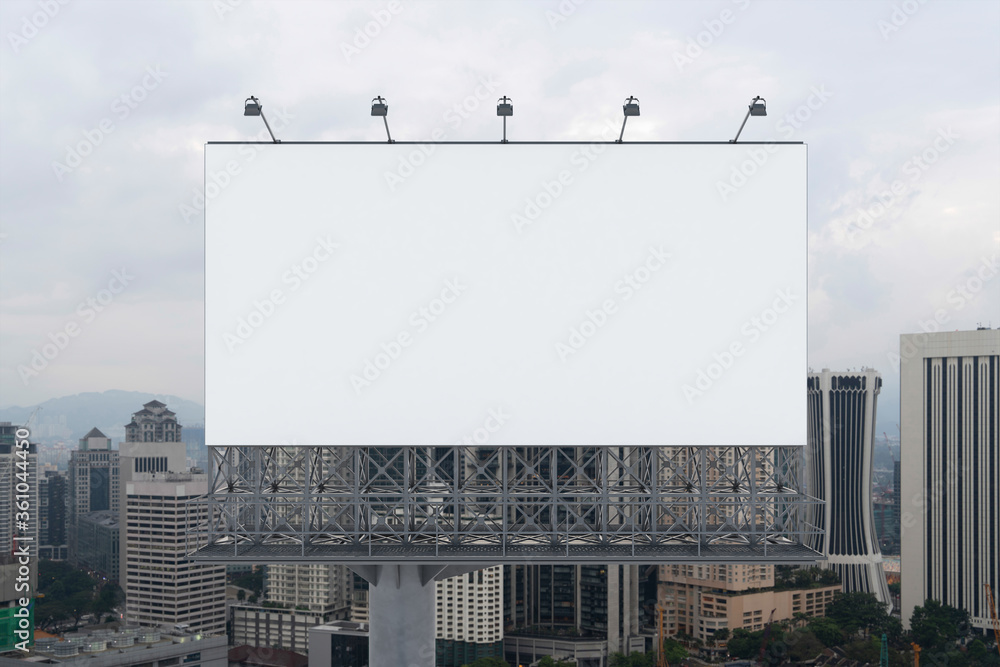 Blank white road billboard with KL cityscape background at day time. Street advertising poster, mock up, 3D rendering. Front view. The concept of marketing communication to promote or sell idea. Blank white road billboard with KL cityscape background at day time. Street advertising poster, mock up, 3D rendering. Front view. The concept of marketing communication to promote or sell idea.