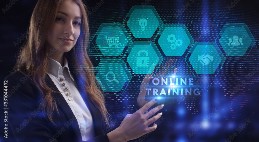 Business, Technology, Internet and network concept. Young businessman working on a virtual screen of the future and sees the inscription: Online training Business, Technology, Internet and network concept. Young businessman working on a virtual screen of the future and sees the inscription: Online training