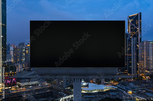 Photography Blank black road billboard with Kuala Lumpur cityscape background at night time