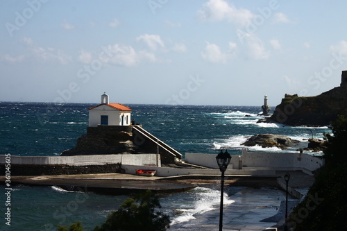 Waves at the small harbour in front of the Chapel of Panagia Thalassini at Andros, Greece  photo