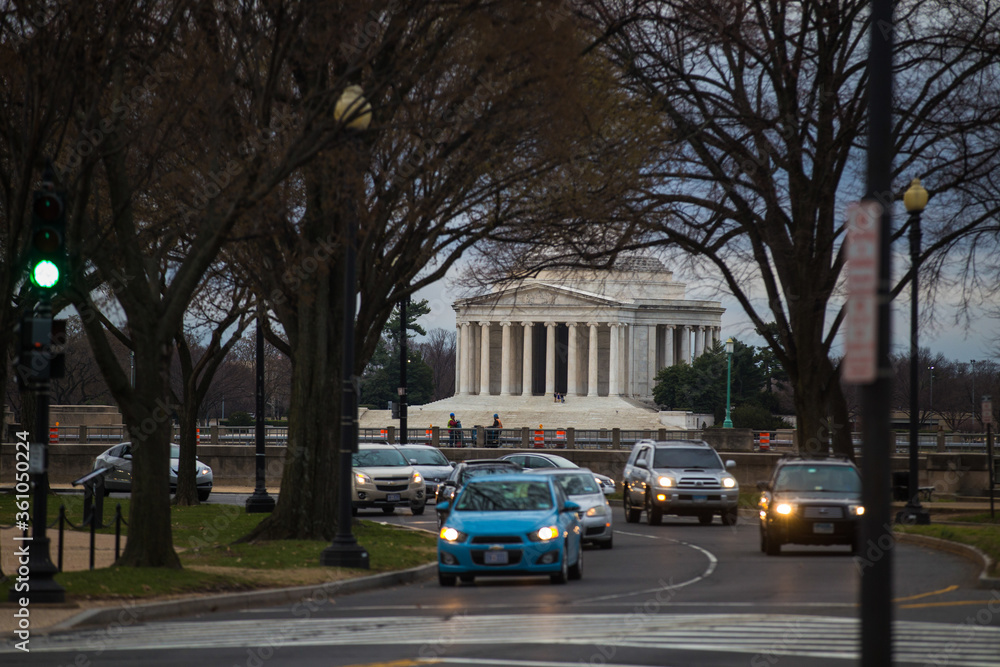 Spring, 2016 - Washington DC, USA - Cars drive along the road in the background of the Lincoln Memorial in Washington DC