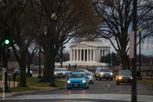 Spring, 2016 - Washington DC, USA - Cars drive along the road in the background of the Lincoln Memorial in Washington DC
