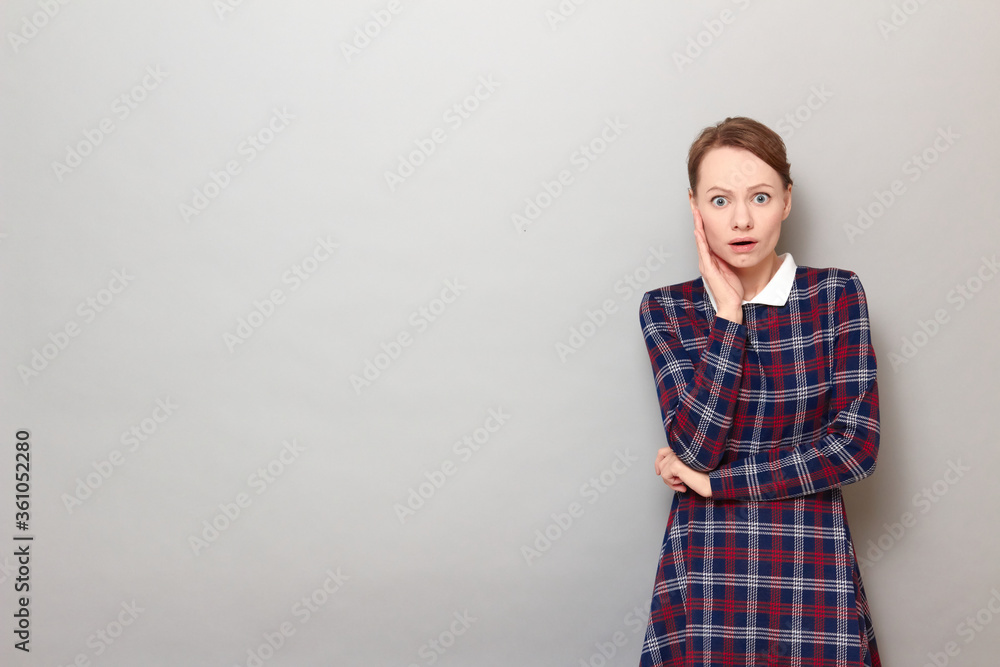 Portrait of sad unhappy shocked girl with widened eyes and open mouth Portrait of sad unhappy shocked girl with widened eyes and open mouth