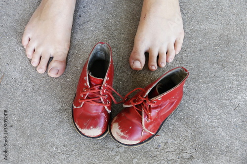 old red children pair of leisure boots and woman foot