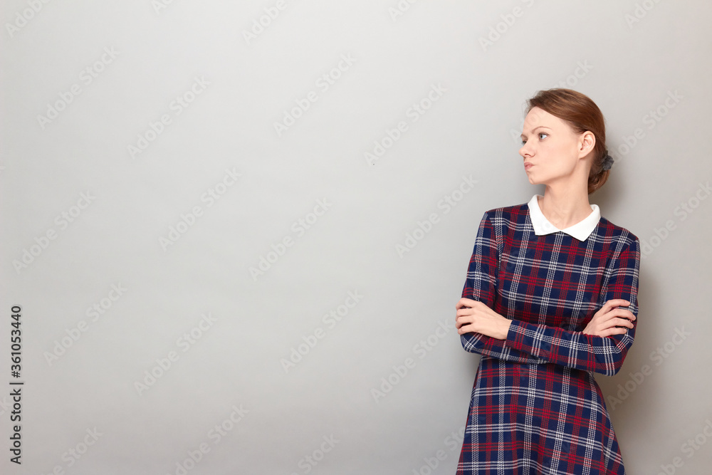 Portrait of thoughtful holding arms folded and being deep in thoughts Portrait of thoughtful holding arms folded and being deep in thoughts