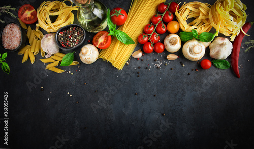 Italian food background with pasta ingredients on dark background, top view, cooking concept, restaurant