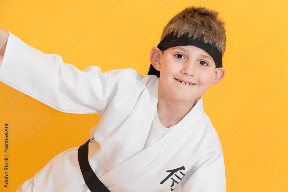 Little boy as a karate fighter. Funny faces.