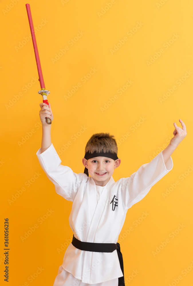 Little boy as a karate fighter. Funny faces.