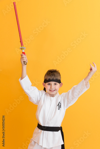 Little boy as a karate fighter. Funny faces.