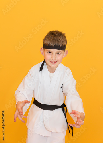 Obraz na płótnie Little boy as a karate fighter. Funny faces. w salonie