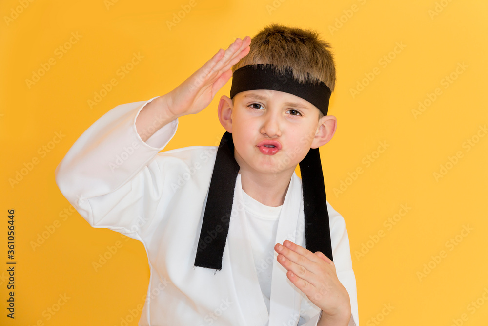 Little boy as a karate fighter. Funny faces.