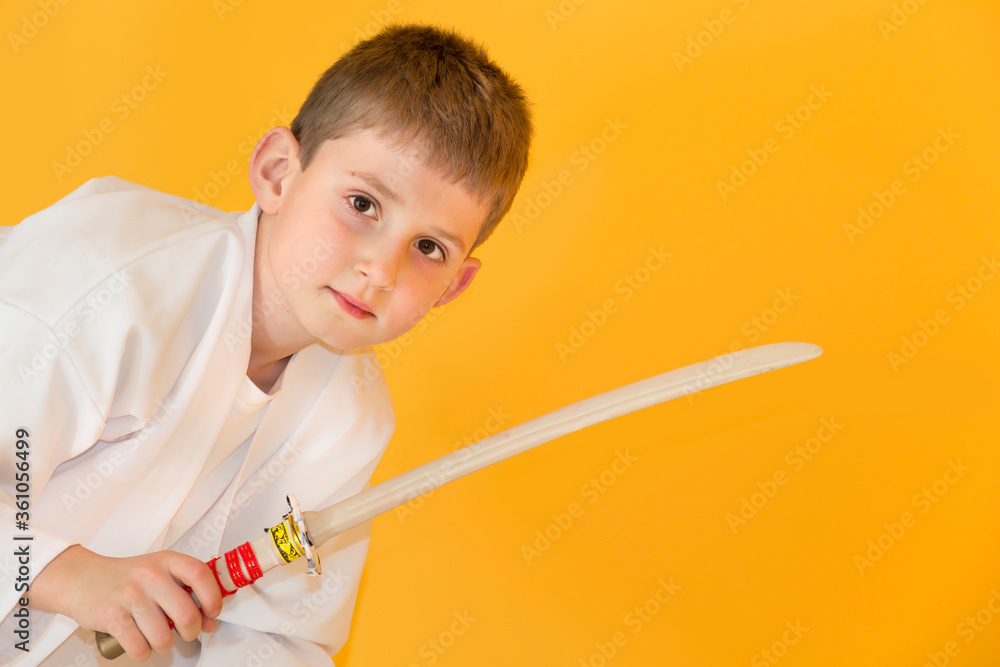 Little boy as a karate fighter. Funny faces.