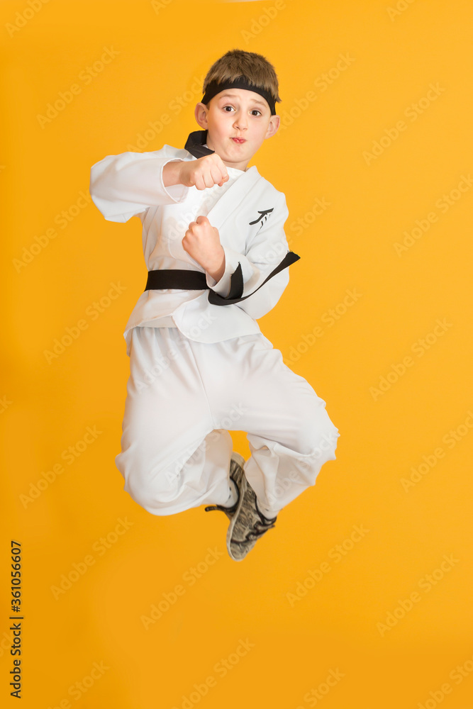 Little boy as a karate fighter. Funny faces.