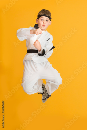 Little boy as a karate fighter. Funny faces.