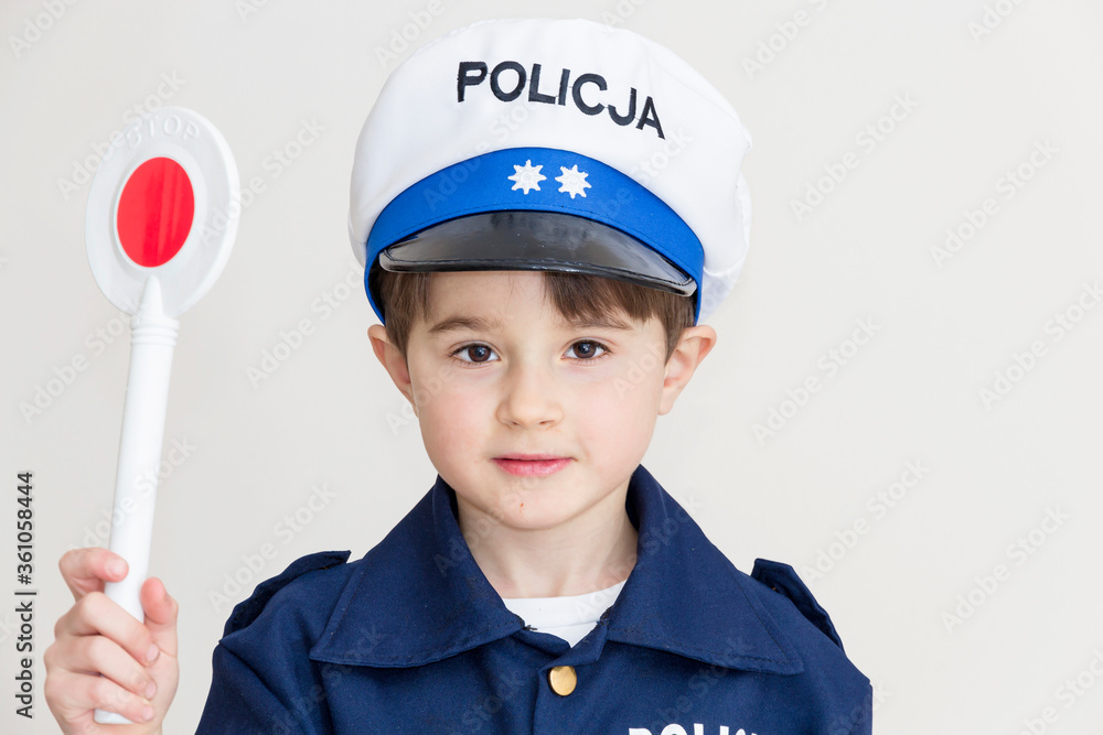 Boy age 6 boy pretending to be a police officer.