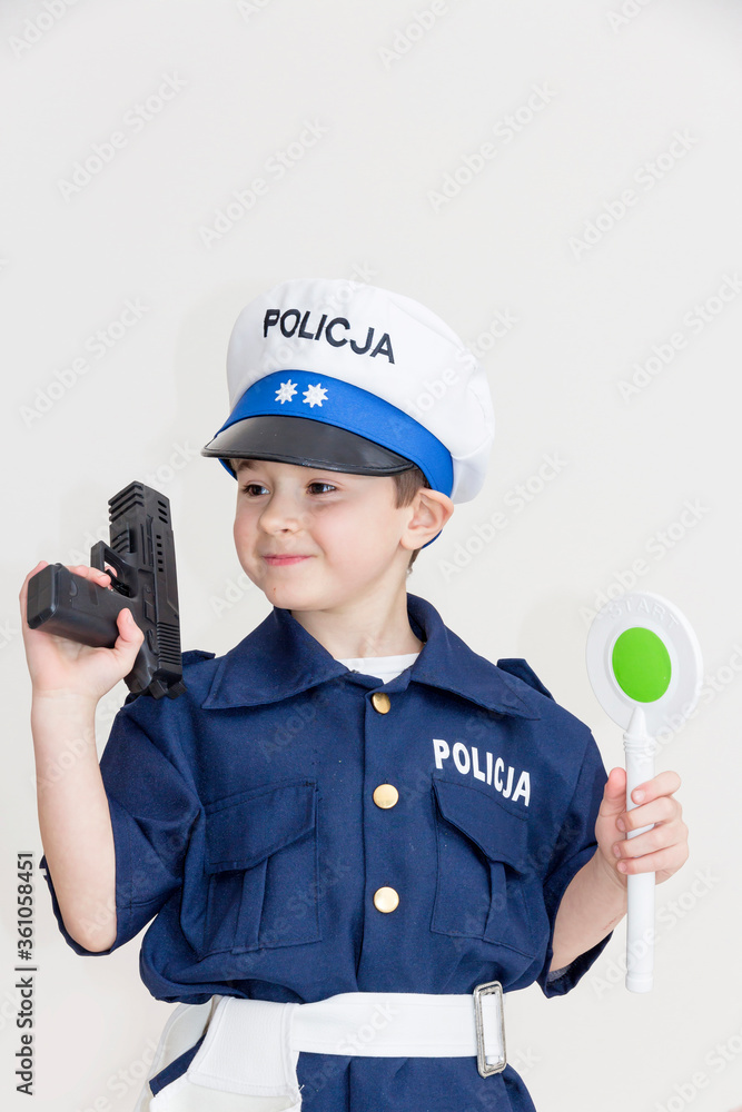 Boy age 6 boy pretending to be a police officer.