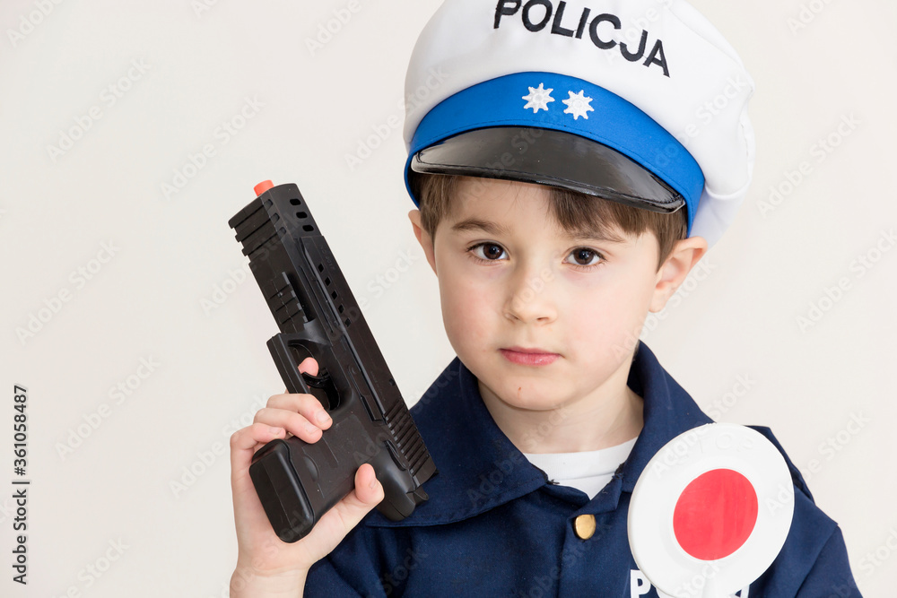 Boy age 6 boy pretending to be a police officer.