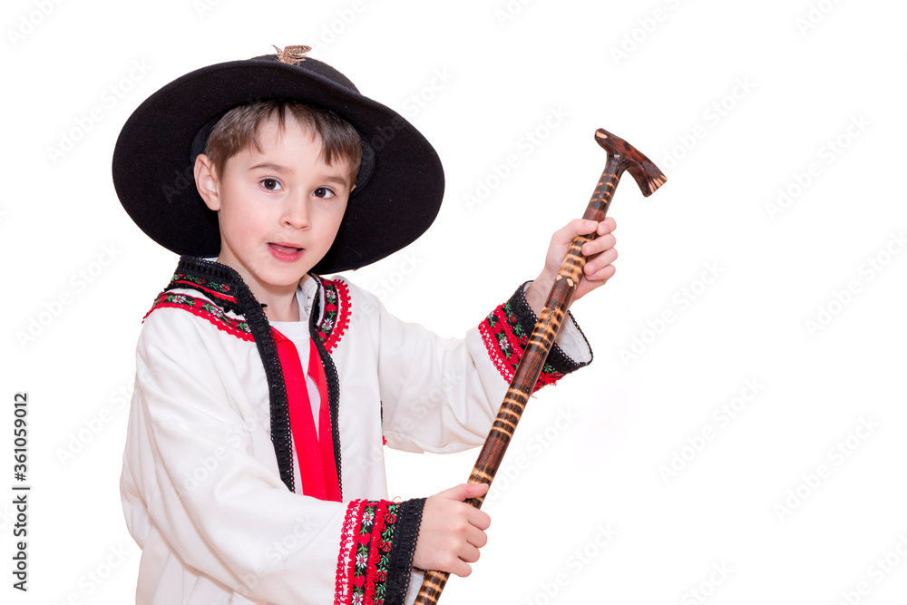 Boy age 6 boy in costume of highlander. Funny faces.