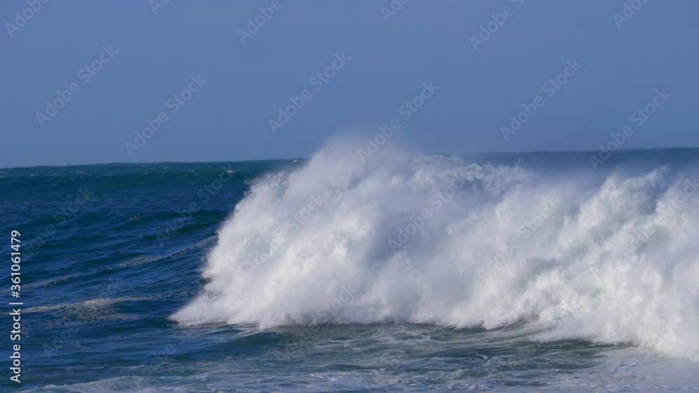 Large waves breaking in slow motion (slomo) at Victoria Bay on the Garden Route, Western Cape, South Africa. Large waves breaking in slow motion (slomo) at Victoria Bay on the Garden Route, Western Cape, South Africa.