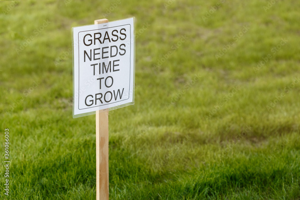 Stay away of the freshly planted grass sign