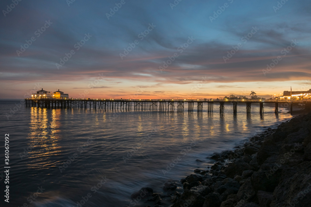 Pacific ocean dusk at Malibu Pier north of Los Angeles, California.