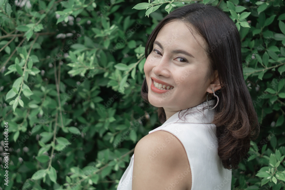 Woman happy feeling with green nature background Woman happy feeling with green nature background