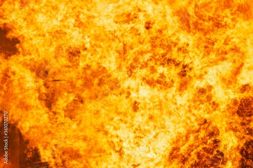 Raging flames of huge fire. Firestorm close up. Burning fire full frame image. Bright inferno flames. Hell fire explosion. Blaze fire texture. Burning bright Bonfire. Intense combustion and heat. 