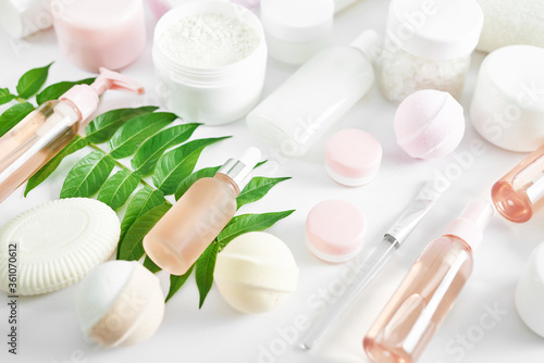 Flat lay composition Natural cosmetics ingredients for skincare, body and hair care.Top view bottles with facial treatment product white background. Makeup Layout. Set of traditional spa products.