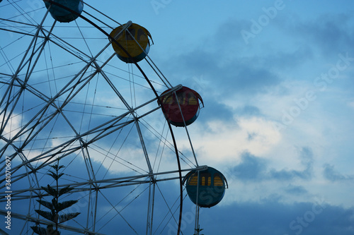 ferris wheel against blue sky