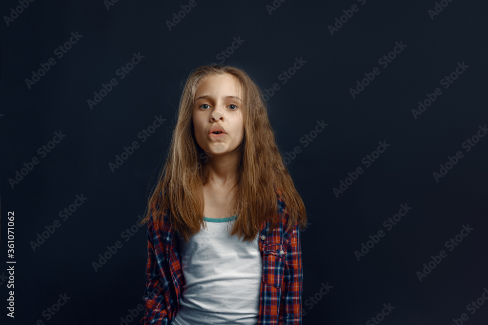 Schoolgirl makes face leaning against the glass Schoolgirl makes face leaning against the glass