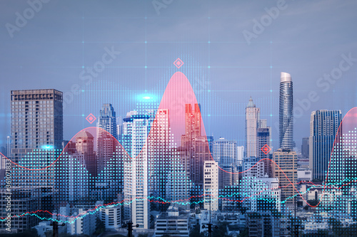 Glowing FOREX graph hologram, aerial panoramic cityscape of Bangkok at sunset. Stock and bond trading in Asia. The concept of fund management. Double exposure.