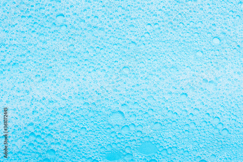 detergent foam, shampoo on blue background.