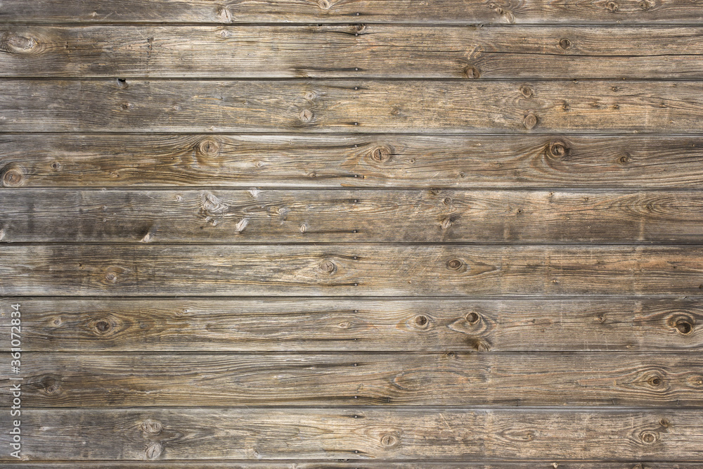 Natural brown barn wood wall. Wall texture background pattern. Natural brown barn wood wall. Wall texture background pattern.