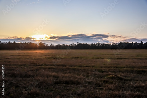 Sun Sets Over Country Land