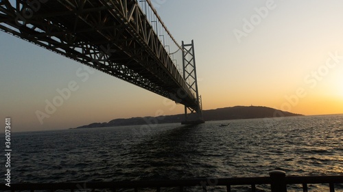 Akashi-Kaikyo Bridge during sunset © craigansibin