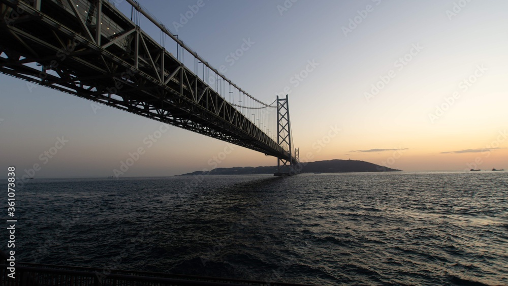 Akashi-Kaikyo Bridge during sunset Akashi-Kaikyo Bridge during sunset