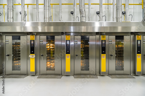A row of commercial bread making ovens